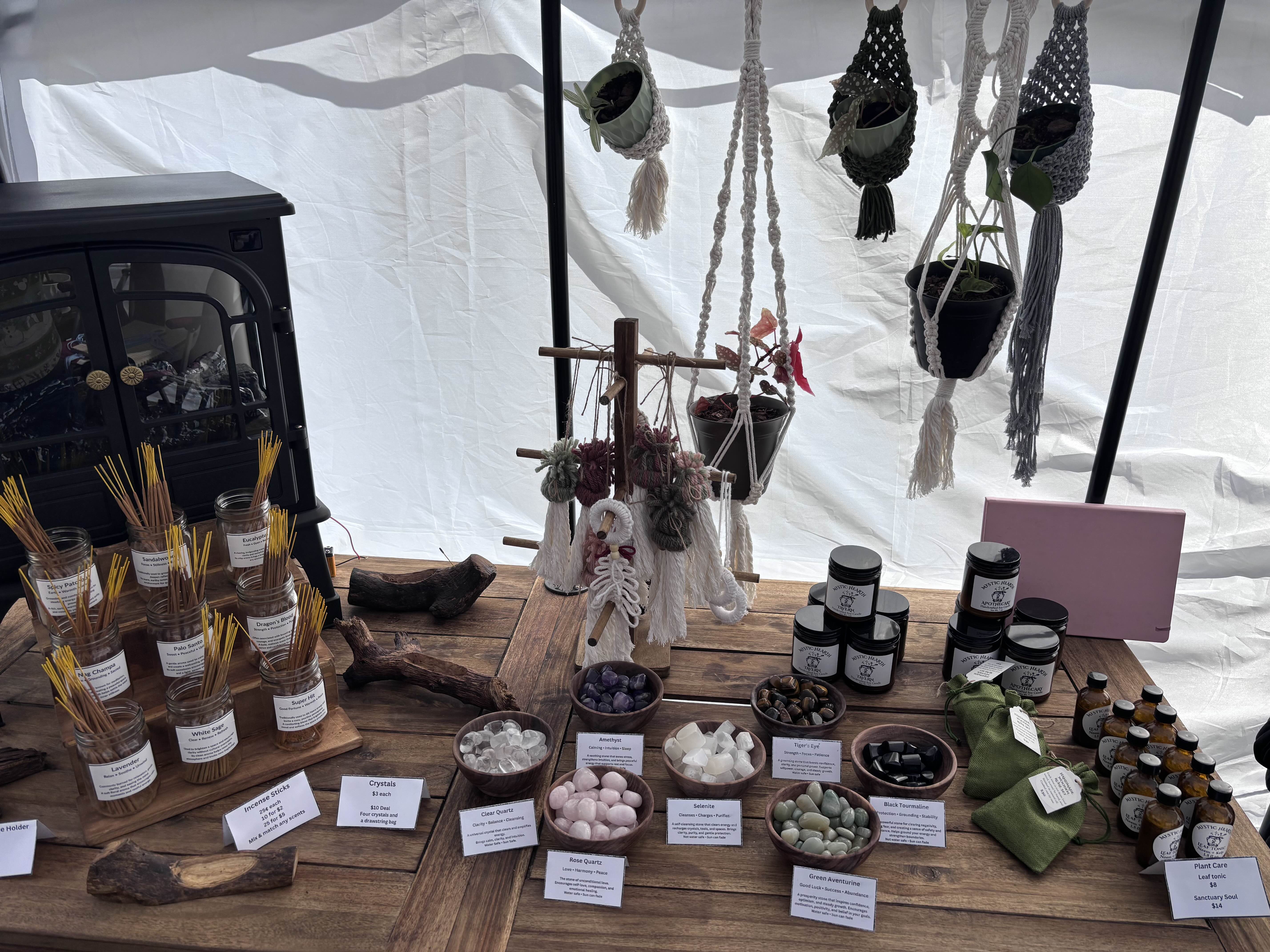 Crystals, incense, and candles displayed on the table